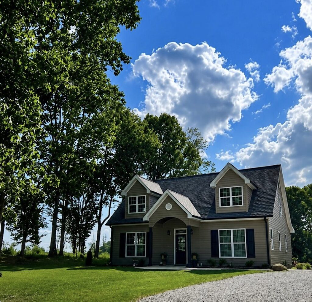 The Woodland Cottage by WOLFE: front exterior among the trees